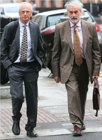  ?? PHOTO: GARETH CHANEY COLLINS ?? Critics: Sport Ireland CEO John Treacy (left) and chairperso­n Kieran Mulvey arrive at Leinster House for the Oireachtas Committee on Sport.