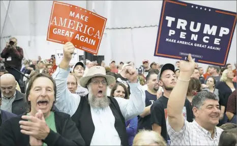  ?? John Locher/Associated Press ?? People cheer during a rally Saturday in Manheim, Pa., for Republican presidenti­al nomiee Donald Trump.