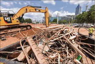  ?? HYOSUB SHIN / HSHIN@AJC.COM ?? Constructi­on of new green space for Centennial Olympic Park downtown continues in the space that used to be the metro Atlanta Chamber building. A major part of 2020 Vision plan involves multiple projects at Centennial Olympic Park.