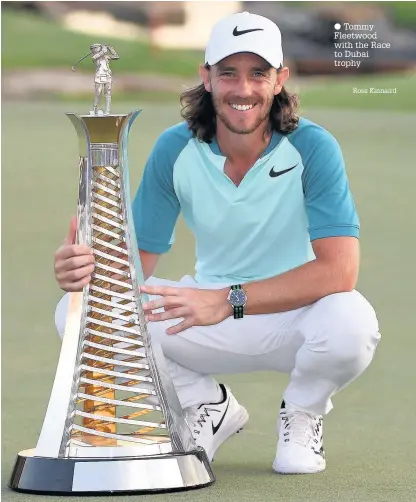  ?? Tommy Fleetwood with the Race to Dubai trophy Ross Kinnaird ??