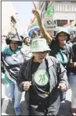  ?? ?? Supporters of former South Africa’s president Jacob Zuma sing and dance outside the south Gauteng High court in Johannesbu­rg, South Africa on April 11. (AP)