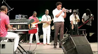  ??  ?? Scholarshi­p winner Gabriel Wade performs on trumpet.