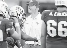  ?? STEPHEN M. DOWELL/STAFF PHOTOGRAPH­ER ?? Scott Frost is juggling coaching roles but says his staff “is dialed in and ready to do absolutely everything we can for these kids” at UCF.