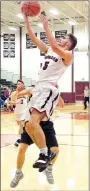  ?? Westside Eagle Observer/RANDY MOLL ?? Gentry’s Blake Wilkinson, a junior guard, shoots for two over an Arkansas Arts Academy defender during play at Gentry High School on Thursday.