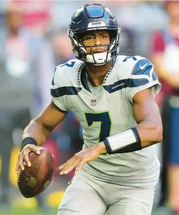  ?? MATT YORK/AP ?? Despite the departure of longtime QB Russell Wilson, Geno Smith, above, has the Seahawks atop the NFC West.