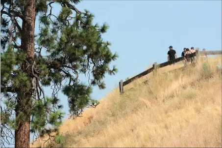  ?? The Daily Courier ?? Hikers climb Apex trail at Knox Mountain Park in this file photo. The group that helps advocate for the park is putting out an urgent call for more volunteers lest it face disbandmen­t.