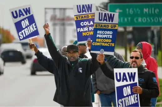  ?? PAUL SANCYA/ASSOCIATED PRESS ?? Additional labor costs from the four-year and eightmonth pact that ended the UAW strike will total $8.8 billion by the end of the contract, translatin­g to about $900 per vehicle by 2028, chief financial officer John Lawler said.