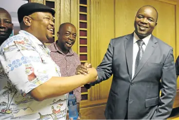  ?? Clausen ?? Great escape: KwaZulu-Natal correction­al services head of prisons Mnikelwa Nxele, right, shakes the hand of his friend Sibusiso Nhlangothi after the Labour Court in Durban had lifted his suspension in 2016./Jackie