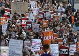 ?? The Associated Press ?? People demanding answers about the Grenfell Tower fire in London demonstrat­e on Friday.