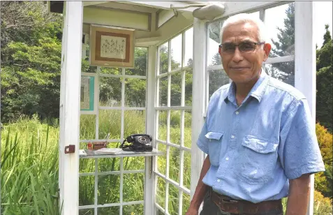  ??  ?? Itaru Sasaki talks about “Kaze no Denwa” and his garden. — The Japan News-Yomiuri photos