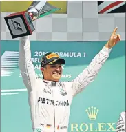  ??  ?? WINNER’S DELIGHT: Nico Rosberg, of Germany and Mercedes GP, celebrates his victory during the Formula One Grand Prix of Belgium at Circuit de Spa-Francorcha­mps in Spa, yesterday