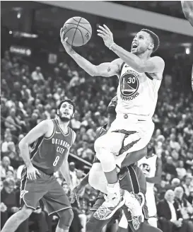  ?? AP ?? STEPH UP. Golden State Warriors’ Stephen Curry (30) lays up a shot past Oklahoma City Thunder forward Jerami Grant, right, during the second half of an NBA basketball game, Tuesday, Oct. 16, 2018, in Oakland, Calif.