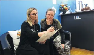  ?? PHOTO: KERRIE WATERWORTH ?? Here’s the plan . . . Wanaka osteopath Liana Poole (left) and Claire O’Connell discuss Ferdia O’Connell’s treatments.