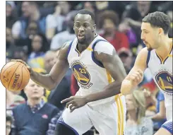  ??  ?? Golden State Warriors’ Draymond Green moves after stealing the ball as Klay Thompson trails in the second half against the Memphis Grizzlies at FedExForum, Memphis. — USA TODAY Sports photo