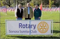  ?? Guy Mccarthy / Union Democrat ?? A new Field of Honor of 250 flags to pay tribute to military veterans and first responders is on display this week and Sunday at Standard Park (top). The display has been organized by the Sonora Sunrise Rotary Club. Rotary Club members (above right, from left) Doug Forte, Dave Thoeny and Scott Dasko visit the field Friday morning. Sara Lockhart (above left, at left) and her husband, U.S. Marine Corps veteran and Tuolumne County Sheriff’s Cpl. Chris Lockhart also visited the field on Friday.