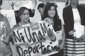  ?? AL SEIB/LOS ANGELES TIMES FILE PHOTOGRAPH ?? Immigrant youth leader Claudia Rueda, right, with her mother Teresa de Jesus Vidal, left, join supporters before she reported for her first check-in with immigratio­n officials in a Los Angeles Federal Building on June 19, 2017.