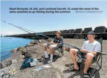  ?? SIMON O’CONNOR/STUFF ?? Noah Richards, 14, left, and Lachland Garrett, 13, made the most of the extra sunshine to go fishing during the summer.