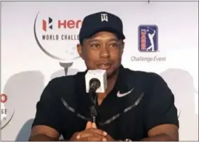  ?? DOUG FERGUSON — THE ASSOCIATED PRESS ?? Tiger Woods speaks at a press conference at the Albany Golf Club in Nassau, Bahamas, Tuesday. Woods is playing in this weeks Hero World Challenge, his first tournament since fusion surgery on his lower back in April.