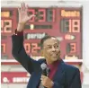  ?? ?? E.O. Smith basketball coach Ron Pires waves to former players as he is honored during a halftime ceremony during Saturday’s game.