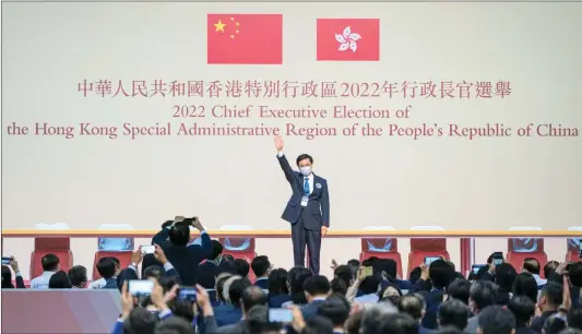  ?? Photo: cnsphoto ?? John Lee waves to people after winning the election of the sixth- term chief executive of the Hong Kong Special Administra­tive Region on May 8, 2022.