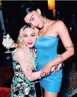  ??  ?? Give momma a hug: The singer with daughter Lourdes, 23