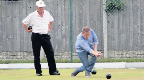  ??  ?? ● Caernarfon bowls player David Noel Williams in action in his match against Dilwyn Owen of Bethesda. Picture: RICHARD BIRCH