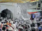  ?? PTI ?? Devotees get showered with perfumed water during Urs at the shrine of Sufi saint Khwaja Moinuddin Chishti in Ajmer.