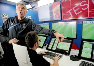  ?? AP ?? VAR refereeing Project Leader Roberto Rosetti demonstrat­es a video operation room. —