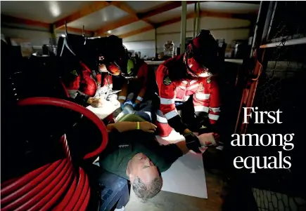  ?? PHOTO: MARTIN DE RUYTER/FAIRFAX NZ ?? Nelson-based Urban Search and Rescue team members with "victim" Shane Sowerby during a mock emergency at Seifried Estate.