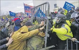  ?? Kent Nishimura Los Angeles Times ?? PRO-TRUMP rioters battle police at the U.S. Capitol on Jan. 6, 2021, symbolic of a willingnes­s to tear down long-standing norms and restraints in pursuit of goals.