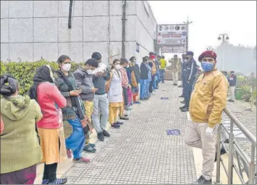  ?? PTI ?? Health care workers queue up to get vaccinated at Rajiv Gandhi Super Speciality Hospital in New Delhi on Saturday.