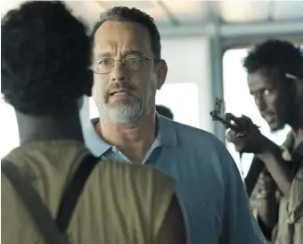  ?? SONY-COLUMBIA PICTURES ?? Tom Hanks, centre, stars in this scene from Captain Phillips, opening Friday.