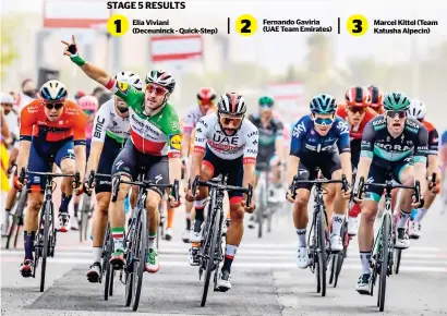  ?? — Supplied photo ?? Elia Viviani (third from left) sprints to finish line with a victory sign.