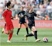  ?? ?? Liv Chance shapes to shoot in the Football Ferns’ game against South Korea in Christchur­ch, tracked by Korean captain Kim Hye-ri.