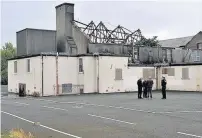  ??  ?? Aftermath The burnt-out building in Blackstoun Road