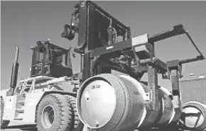  ??  ?? A forklift carries a cylinder of uranium hexafluori­de gas meant for Iran’s Fordo nuclear facility in November 2019.