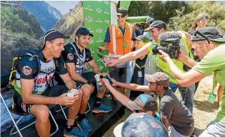 ?? GETTY IMAGES ?? He may be long since retired, but former All Blacks captain Richie McCaw still attracts a huge media following. McCaw, right, answers questions alongside Coast to Coast teammate Rob Nichol at the end of the mountain running stage.