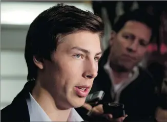  ?? JEFF MCINTOSH /THE CANADIAN PRESS ?? Ryan Nugent-Hopkins speaks to the media after arriving in Calgary on Monday for the national junior hockey team selection camp. “I’m really happy that I got the opportunit­y to try again,” he says.