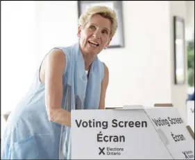  ?? CP PHOTO ?? Ontario Liberal Leader Kathleen Wynne votes in Toronto on Thursday.