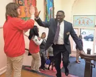  ?? CHRIS KOHLEY / MILWAUKEE JOURNAL SENTINEL ?? Milwaukee Public Schools Interim Superinten­dent Keith Posley gives a high-five as he enters Clarke Street School Monday morning.