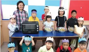  ??  ?? Students bake cookies as part of their co-curriculum activities at ELC.