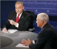  ?? THE ASSOCIATED PRESS ?? Republican vice presidenti­al nominee Gov. Mike Pence, right, and Democratic vice presidenti­al nominee Sen. Tim Kaine speak Tuesday during the vice presidenti­al debate at Longwood University in Farmville, Va.