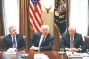  ?? THE ASSOCIATED PRESS ?? Sen. Dick Durbin, D-Ill., left, and Rep. Steny Hoyer, D-Md. listen as President Donald Trump speaks Tuesday during a meeting with lawmakers on immigratio­n policy in the Cabinet Room of the White House.