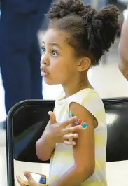  ?? ?? Khrei Harris 5, never cried as she got a series of shots at the vaccinatio­n clinic.