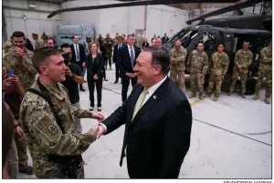  ?? AP/ANDREW HARNIK ?? Secretary of State Mike Pompeo meets with coalition forces Monday at Bagram air base in Afghanista­n.