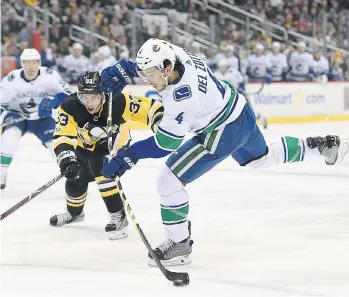  ?? JUSTIN BERL/GETTY IMAGES ?? Vancouver’s Michael Del Zotto first met Liam Traynor following a January 2010 practice as part of an initiative that benefits the lives of children facing obstacles.