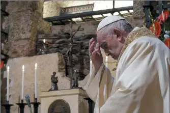  ?? DIVISIONE PRODUZIONE FOTOGRAFIC­A — THE ASSOCIATED PRESS ?? Pope Francis celebrates Mass in the crypt of the Basilica of St. Francis, in Assisi, Italy, on Saturday. Pope Francis travelled to the homeland of his nature-loving namesake on Saturday to sign an encyclical laying out his vision of a post-COVID world built on solidarity, fraternity and care for the environmen­t. In his first outing from Rome since the coronaviru­s lockdown, Francis celebrated Mass on Saturday in the crypt of the Basilica of St. Francis in the Umbrian hilltop town of Assisi.