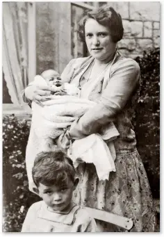  ??  ?? Patricia in her mother’s arms, with brother John in front, in August 1928.