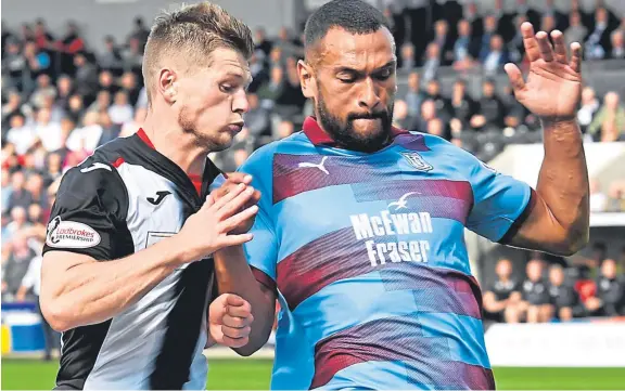  ?? Picture: SNS. ?? Steven Caulker, right, goes up against Cammy Smith in the first clash between Dundee and St Mirren in Paisley in August.