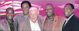  ?? Alex Orlov ?? HUGHES, center, poses with former USC football players and friends, from left, Lynn Swann, Al Cowlings, Sam Cunningham and Rodney Peete. Hughes has a focus on the athletic department.